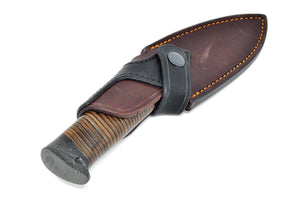 Leather handle knife in the sheath