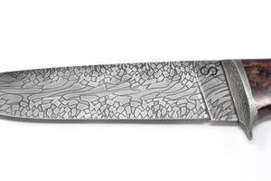 Knife has a beautiful Damascus pattern